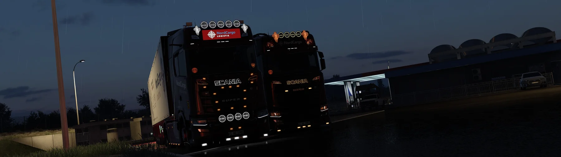 Zwei NordCargo Scania im Regen